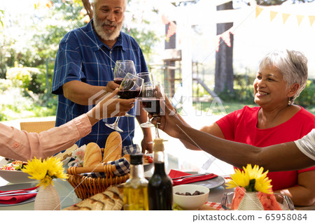 Family eating together at table 65958084