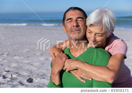 Senior Caucasian couple enjoying time at the beach Senior Caucasian couple enjoying time at the beach 65958171