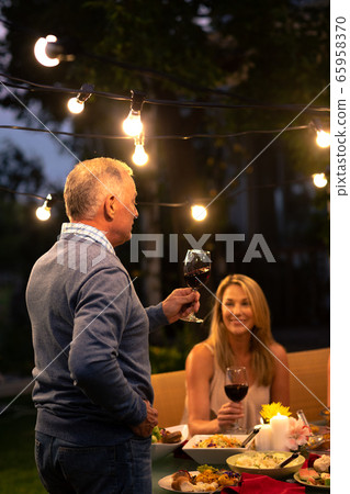 Happy Caucasian family eating together at table 65958370