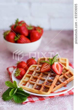 Delicious fresh baked belgian waffles with berries 65959005