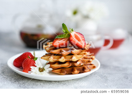 Delicious fresh baked belgian waffles with berries 65959036