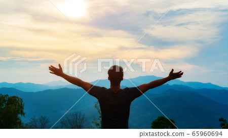 Man feeling fresh when staying at a mountain. Man feeling fresh when staying at a mountain. 65960694
