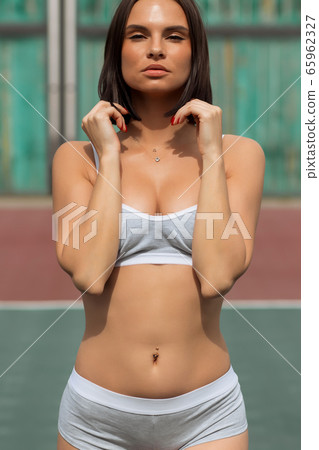 Seductive slender woman in sportive lingerie 65962327