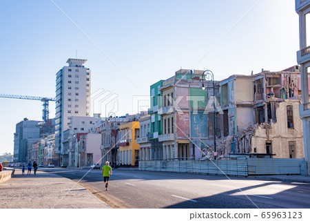 People jogging on Malecon Street in Havana, Cuba 65963123