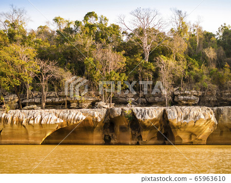Impressive stone formations on the banks of Manambolo river, Tsingy de Bemaraha Strict Nature Reserve, Madagascar Impressive stone formations on the banks of Manambolo river, Tsingy de Bemaraha Strict Nature Reserve, Madagascar 65963610