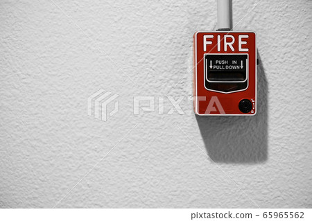 Fire alarm on white wall with copy space 65965562