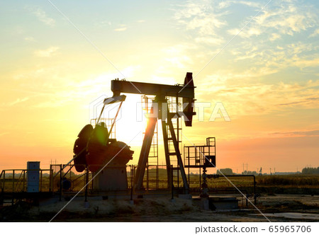 Oil drilling derricks at desert oilfield for fossil fuels output and crude oil production Oil drilling derricks at desert oilfield for fossil fuels output and crude oil production 65965706