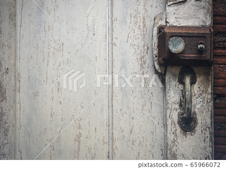 Old rusty door lock on wooden antique door 65966072