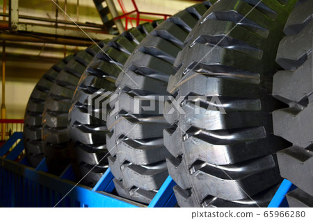 Warehouse with tires for trucks at an industrial plant for the production of cars Warehouse with tires for trucks at an industrial plant for the production of cars 65966280