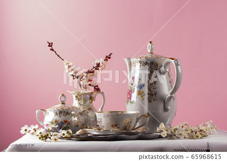 Antique tea set on a pink background 65968615