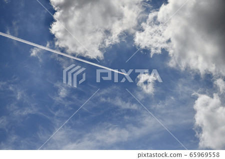 Japanese cloud landscape, rainbow-colored contrails and blue sky Japanese cloud landscape, rainbow-colored contrails and blue sky 65969558