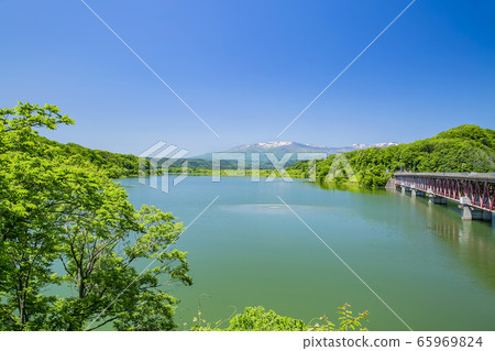 Kamafusa dam Zao mountain range rural landscape 65969824