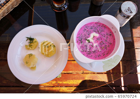 Cold beetroot soup with sour cream, greens and hot Cold beetroot soup with sour cream, greens and hot 65970724
