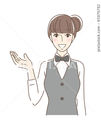 A woman facing the front smiling and holding out her hand 65970782