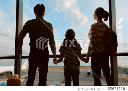 Happy family at the airport. Happy family at the airport. 65971536