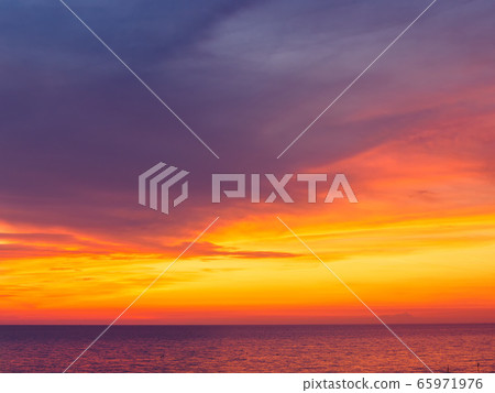 Amazing dramatic sunset sky over calm sea Amazing dramatic sunset sky over calm sea 65971976