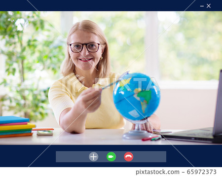 Online remote learning. Teacher with computer. Online remote learning. Teacher with computer. 65972373