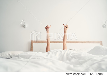 Female hands showing a gesture of approval 65972886
