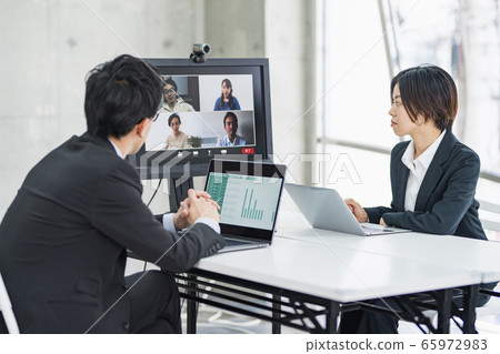 Businessmen having a web conference with staff at home Businessmen having a web conference with staff at home 65972983