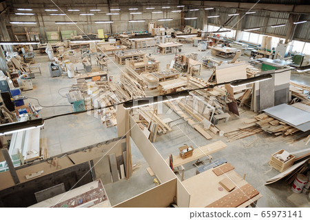 Interior of large workshop of contemporary furniture factory with workplaces 65973141