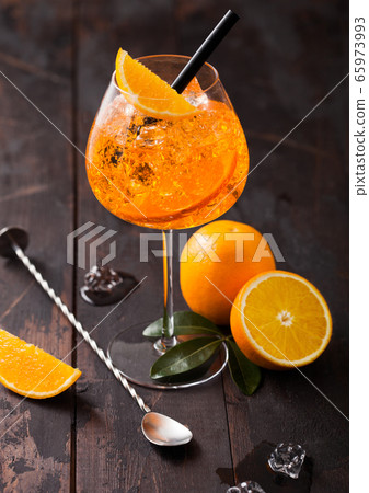 Glass of aperol spritz summer cocktail with orange 65973993