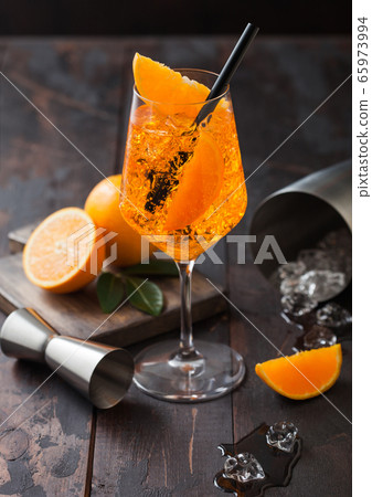 Glass of aperol spritz summer cocktail with 65973994