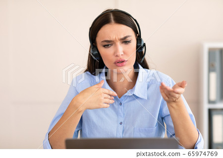 Hotline Manager Woman Receiving Negative Client's Call Sitting In Office Hotline Manager Woman Receiving Negative Client's Call Sitting In Office 65974769