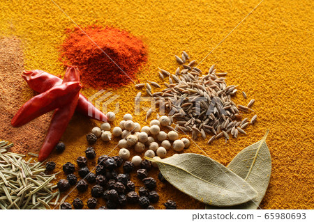 Various spices and various spice spices taken on a warm color background 65980693