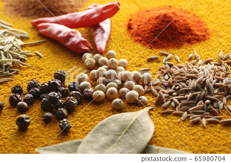 Various spices and various spice spices taken on a warm color background Various spices and various spice spices taken on a warm color background 65980704