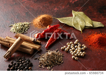 Various spices and various spice spices taken on a warm color background Various spices and various spice spices taken on a warm color background 65980734