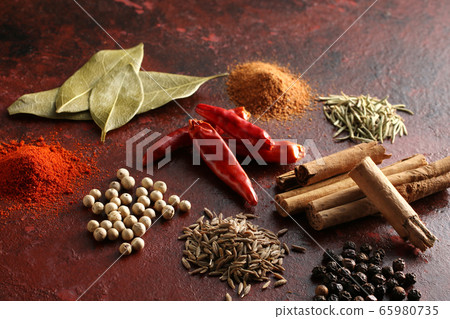 Various spices and various spice spices taken on a warm color background Various spices and various spice spices taken on a warm color background 65980735