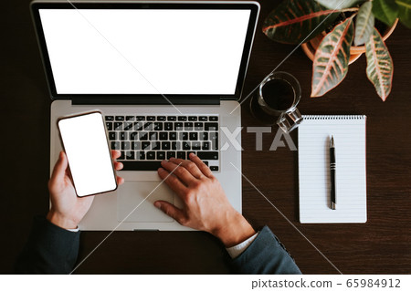 office workplace with manager using laptop and office workplace with manager using laptop and 65984912