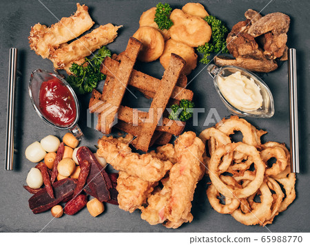 set of snacks for beer with breadcrumbs, sausage, cheese, sauces 65988770