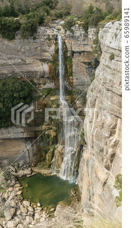 High water jump with cliff fall in mountainous 65989141