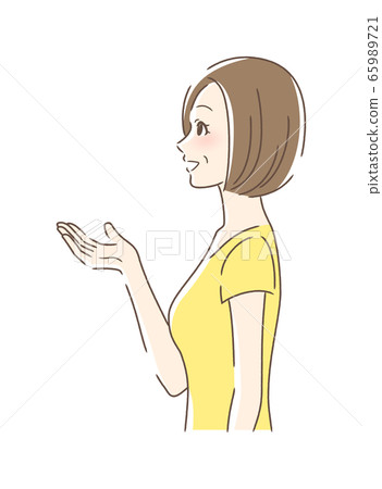 Side profile of a woman smiling and holding out her hand Side profile of a woman smiling and holding out her hand 65989721