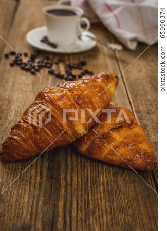 Croissant and coffee 65990374
