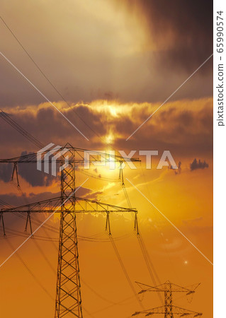 High voltage power lines. Electricity Pylons at Sunset High voltage power lines. Electricity Pylons at Sunset 65990574