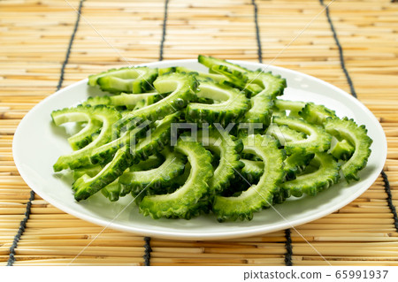 Bitter gourd (slice). Bitter gourd (slice). 65991937