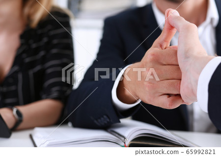 Group business peoples shake hands as hello in office closeup Group business peoples shake hands as hello in office closeup 65992821