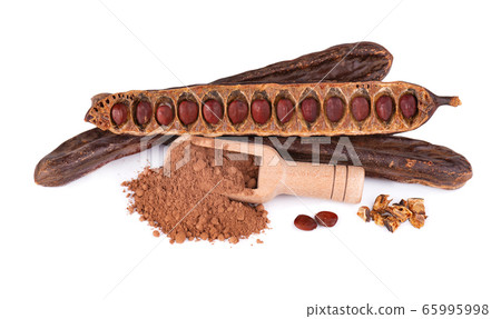 Ripe carob pods and bean isolated on white Ripe carob pods and bean isolated on white 65995998