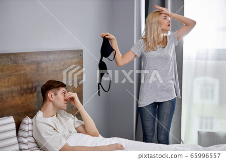 young caucasian woman found strange bra at home young caucasian woman found strange bra at home 65996557