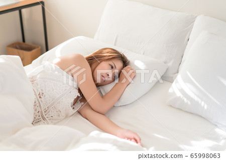 Portrait of beautiful Asian woman with attractive 65998063