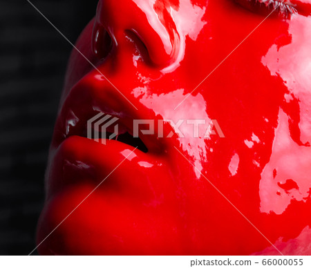 Shot of a female's open mouth with glossy red paint Shot of a female's open mouth with glossy red paint 66000055