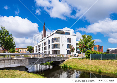 Modern buildings and old church in the city Modern buildings and old church in the city 66000766