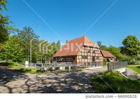 Historical water mill with trees in Kuchelmiss Historical water mill with trees in Kuchelmiss 66000828
