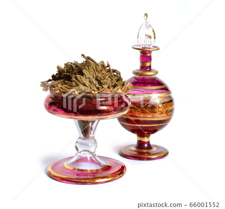 Dried Pachouli plant with vintage perfume bottle. Dried Pachouli plant with vintage perfume bottle. 66001552