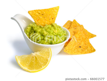Guacamole with nachos. Isolated on white Guacamole with nachos. Isolated on white 66001577