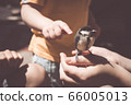 little boy is playing with a chick at the day 66005013