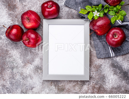 Fresh red ripe apples on gray background 66005222