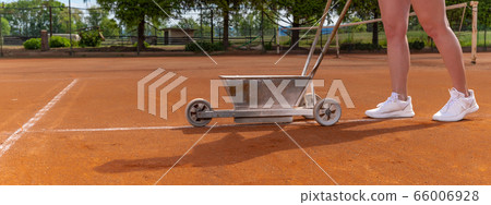 maintenance and repair of tennis courts. drawing white lines with lime 66006928